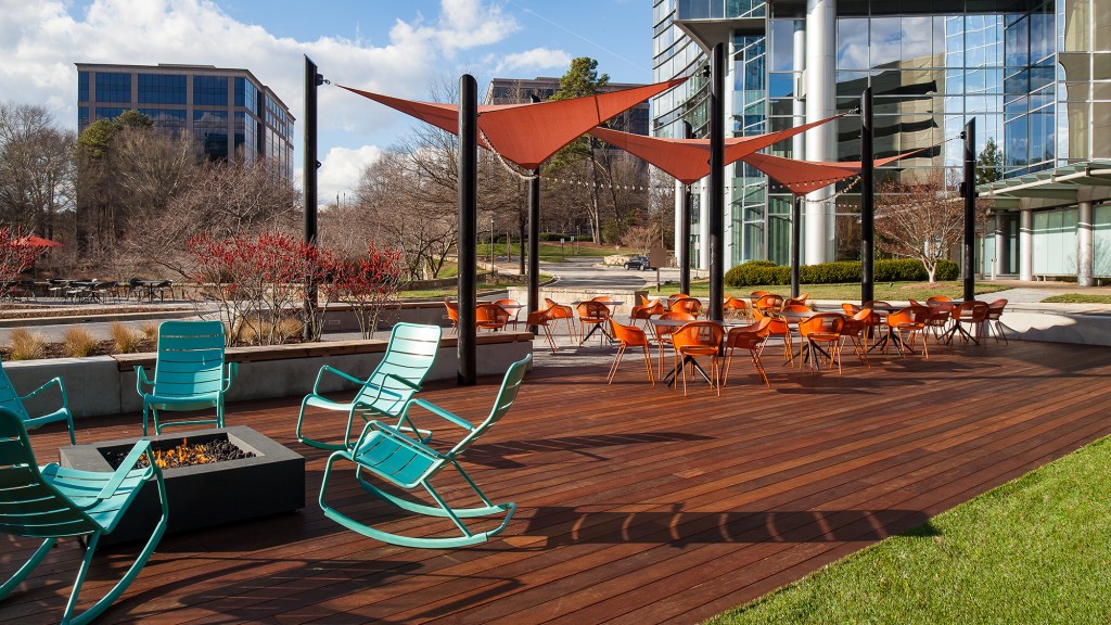 A group of tables and chairs outside.